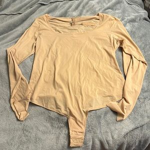 Skims long sleeve bodysuit.